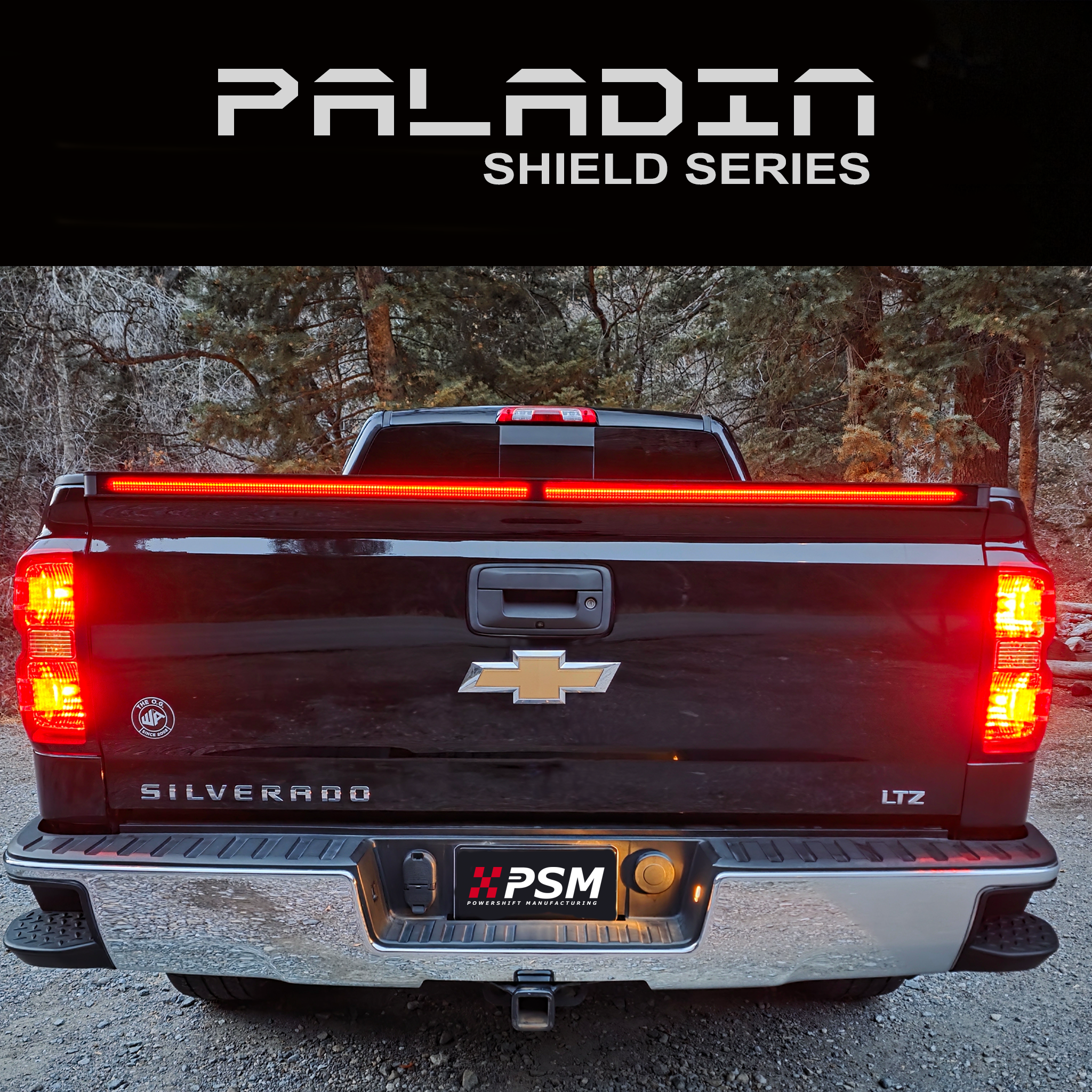 Chevy Silverado 2014–2018 with PSM PALADIN LED tailgate protector. Close up rear view shot with brake lights activated