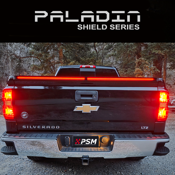Chevy Silverado 2014–2018 with PSM PALADIN LED tailgate protector. Close up rear view shot with brake lights activated