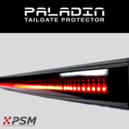 Close up PSM PALADIN LED tailgate protector on a truck bright red high intensity LED's activated