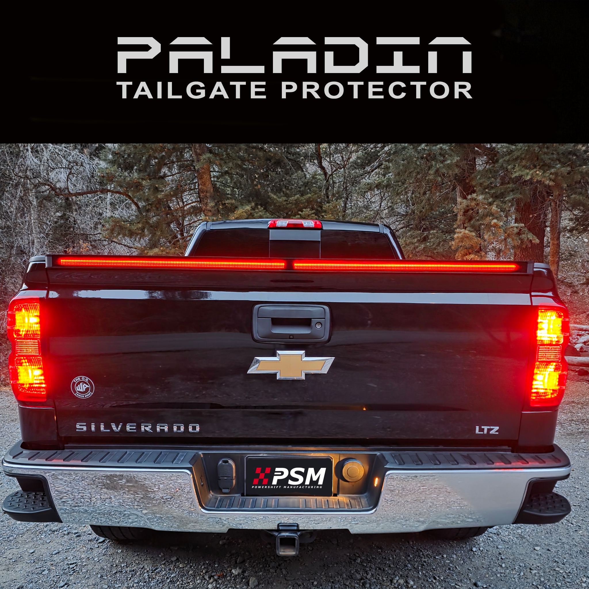 Chevy Silverado 2014–2018 with PSM PALADIN LED tailgate protector. Close up rear view shot with brake lights activated.
